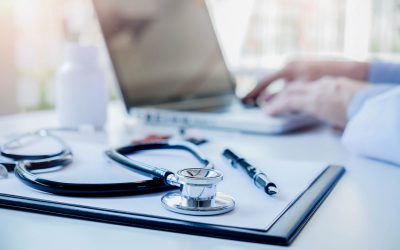 Stethoscope with clipboard and Laptop on desk Doctor working in hospital writing a prescription Healthcare and medical concept test results in background vintage color selective focus. Stethoscope with clipboard and Laptop on desk Doctor working in hospital writing a prescription Healthcare and medical concept test results in background vintage color selective focus.