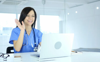 Doctor Busy Online Video Chat on Laptop at Work Doctor Busy Online Video Chat on Laptop at Work