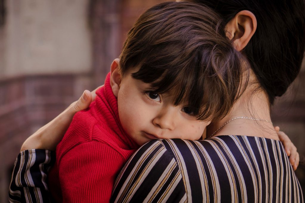 Mother hugging her child, palliative care emergencies