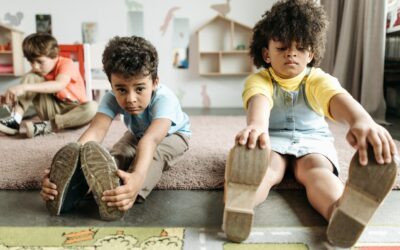 pexels-pavel-danilyuk-8422103_1 Two young children, boy and girl, stretching in excercise